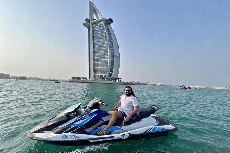 Adventurous Tourist Riding Jet Ski in Front of Burj Al Arab